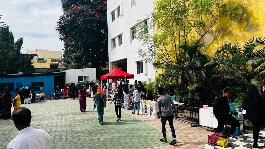 A wide view of the college courtyard bustling with students during the food fest.