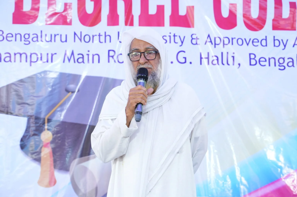An older gentleman giving a speech at the graduation ceremony.